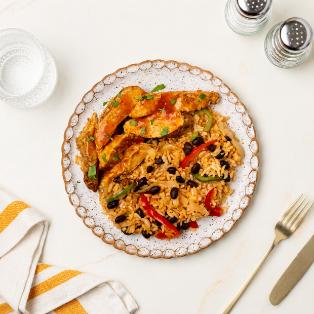 Portuguese-style grilled chicken with rice and beans￼